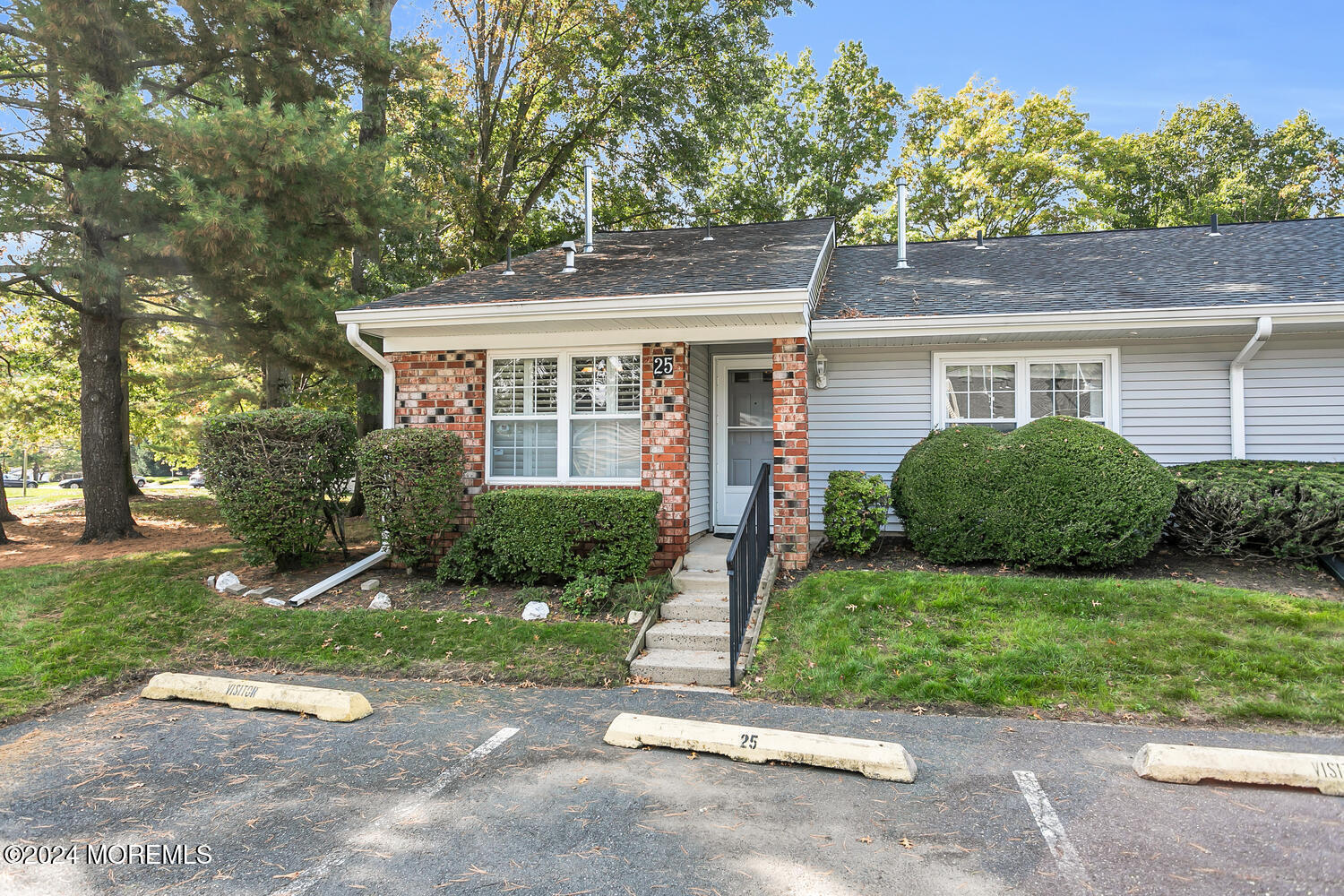 front view of a house with a yard