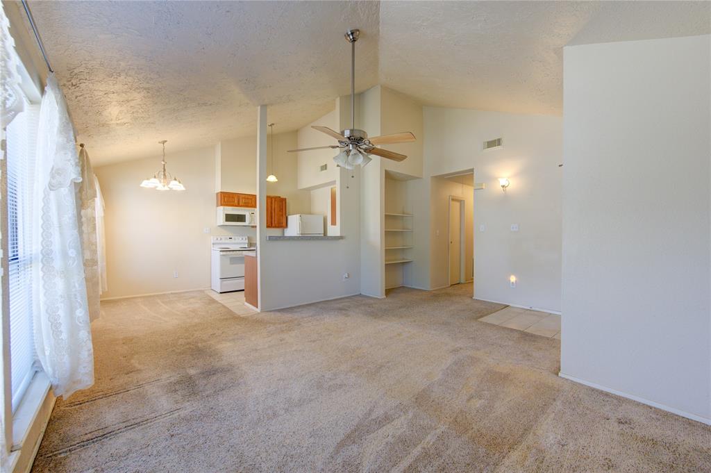 a view of a kitchen with a sink and a cabinet