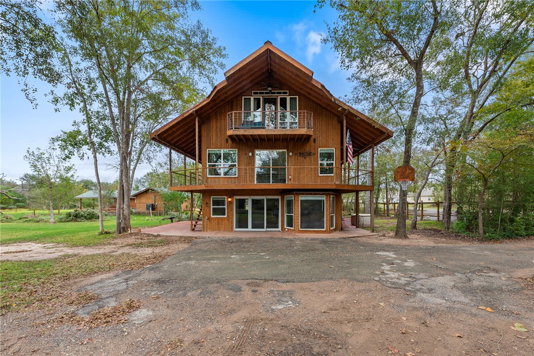 Rear view of property featuring a balcony