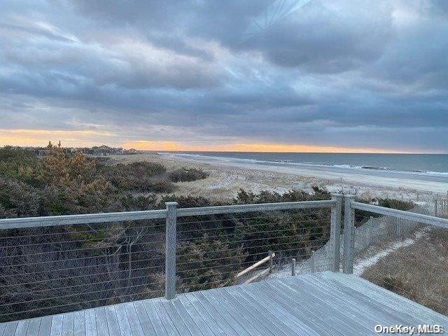 a view of a balcony with an ocean view