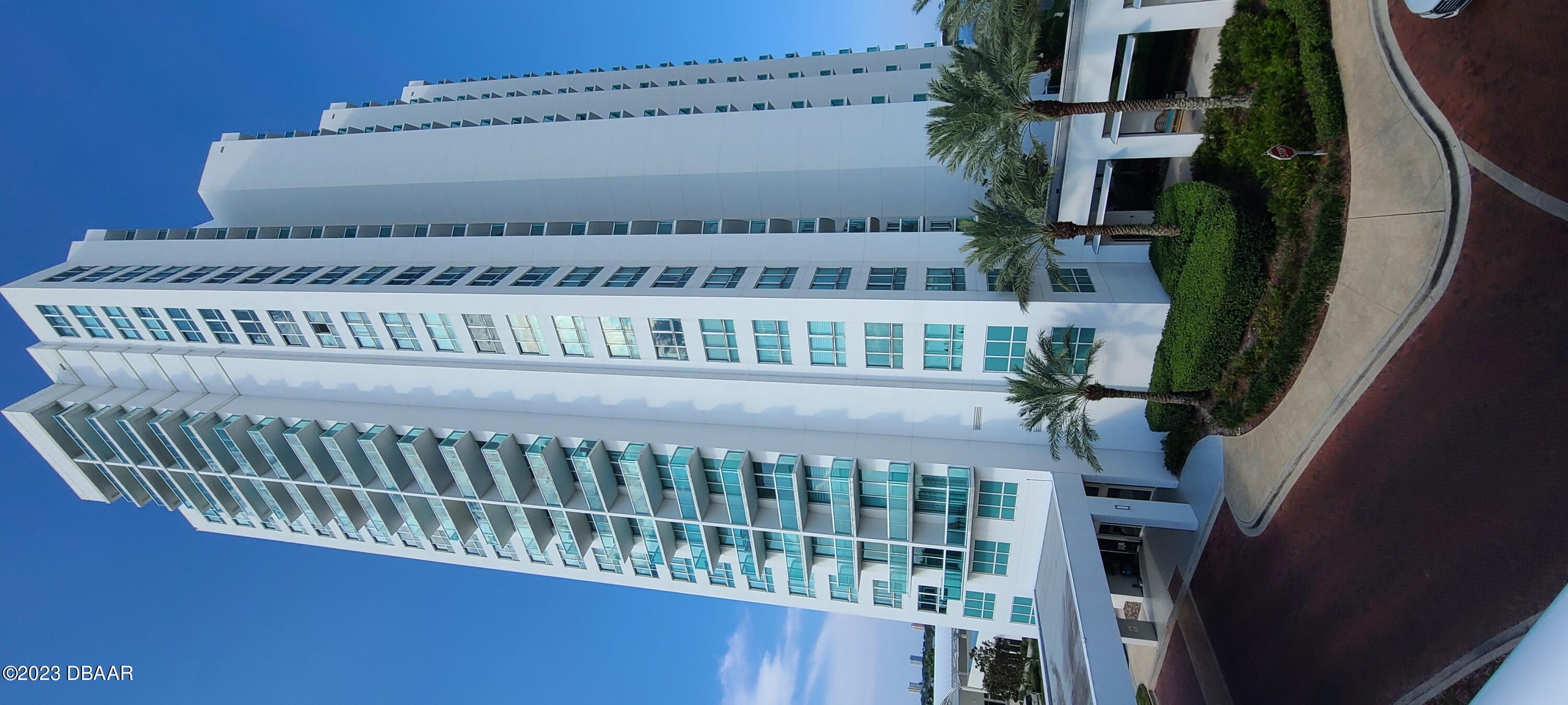 a front view of a building with glass windows