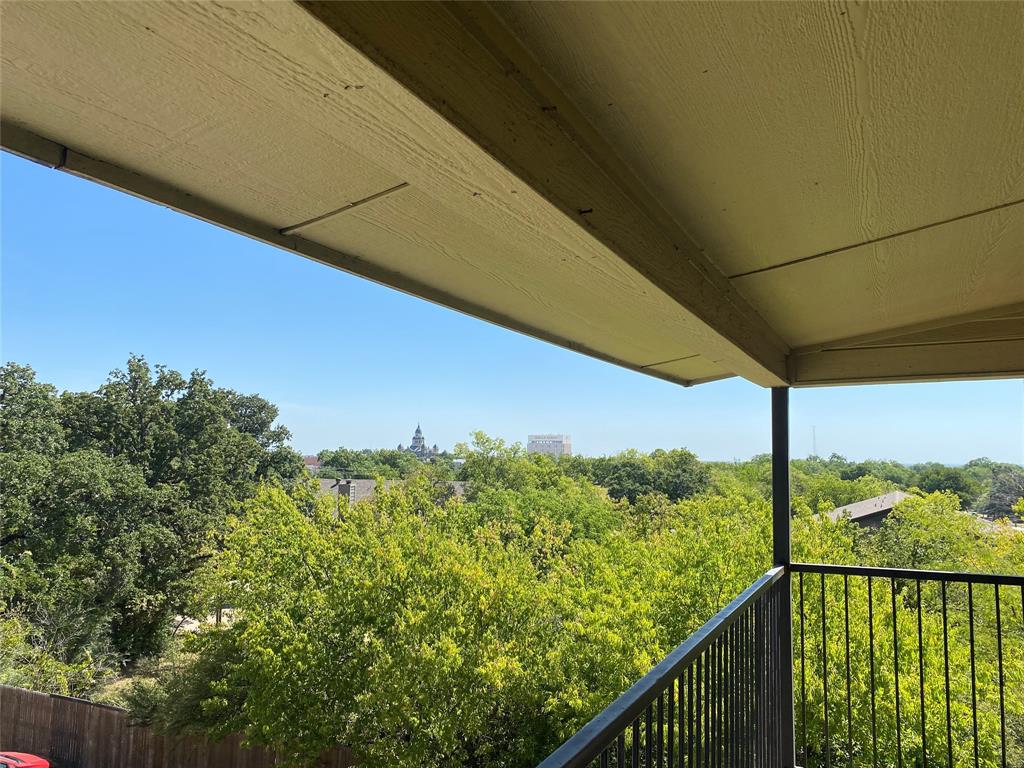 a view of a balcony with an outdoor space