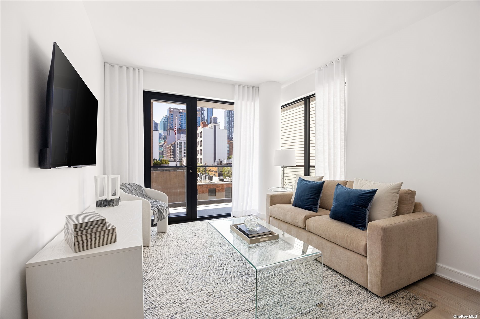 a living room with furniture and a flat screen tv