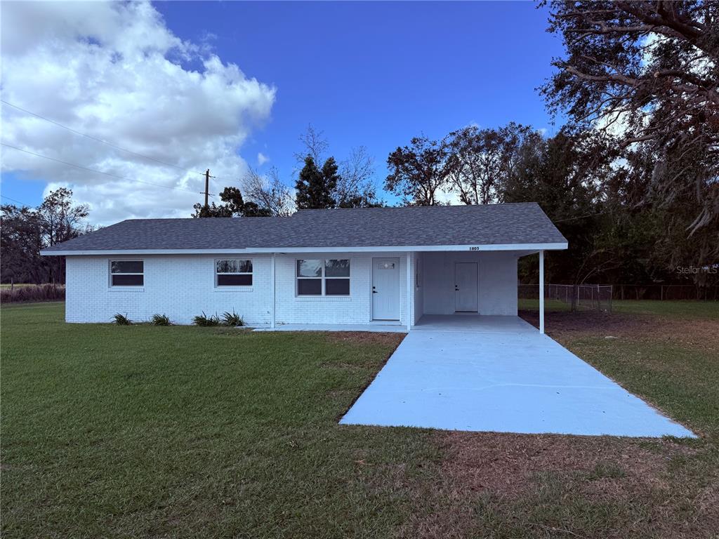 front view of a house with a yard