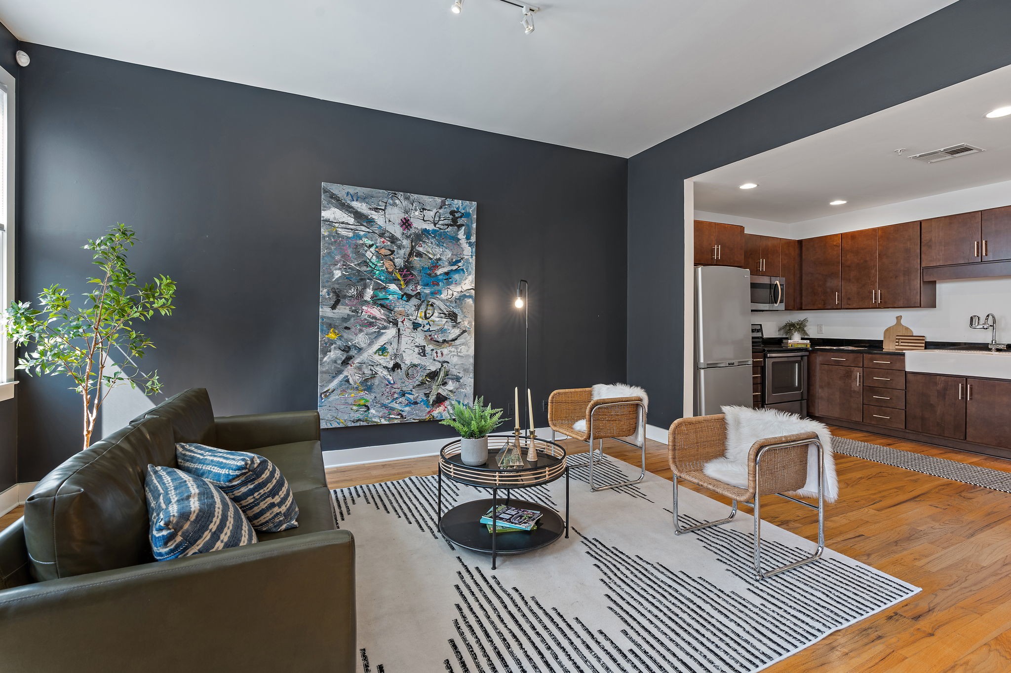 a living room with furniture and a rug