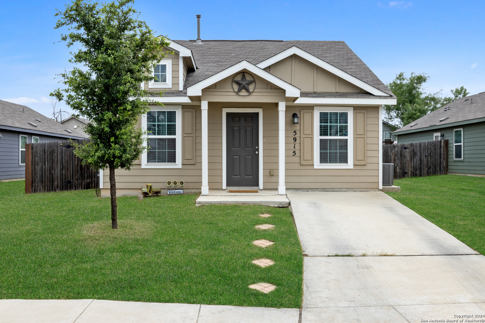 a front view of a house with a yard