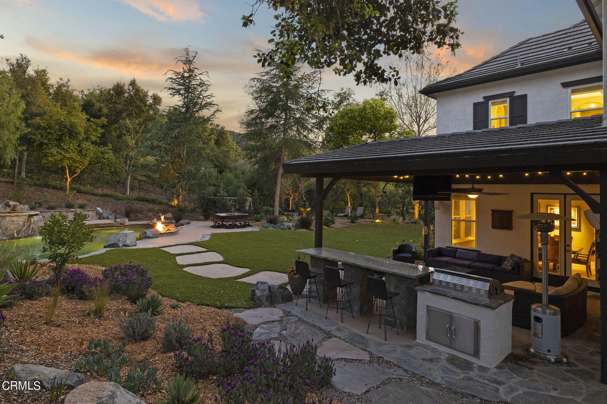 a view of a backyard with sitting area