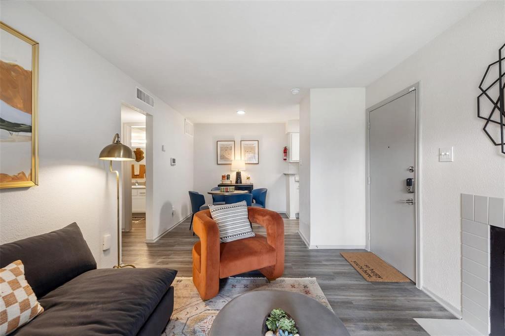 a living room with furniture and a rug