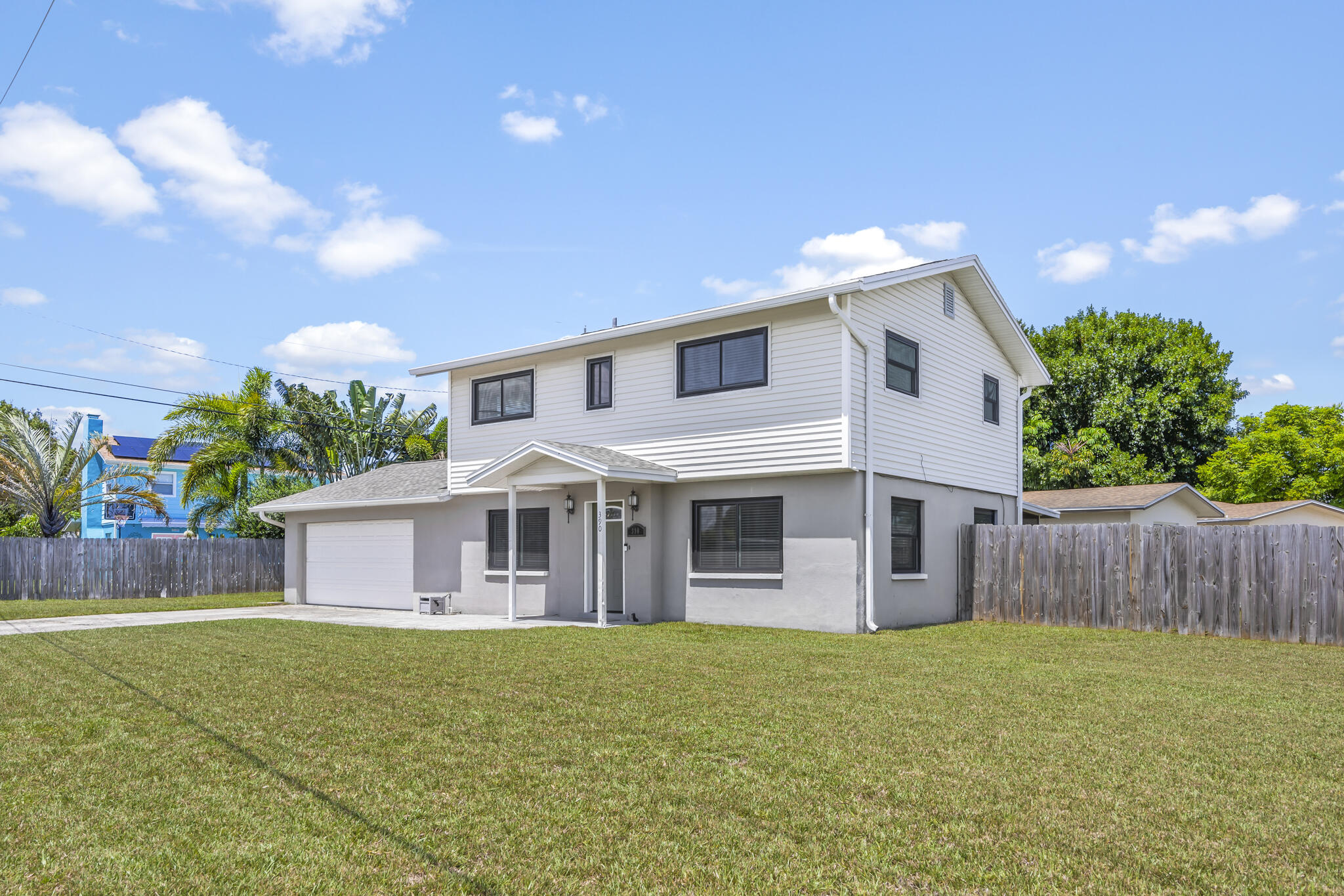 a front view of house with yard and outdoor seating