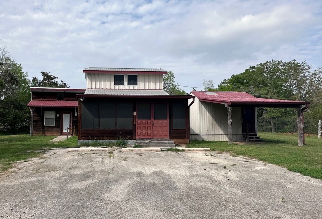 a view of house with yard and entertaining space