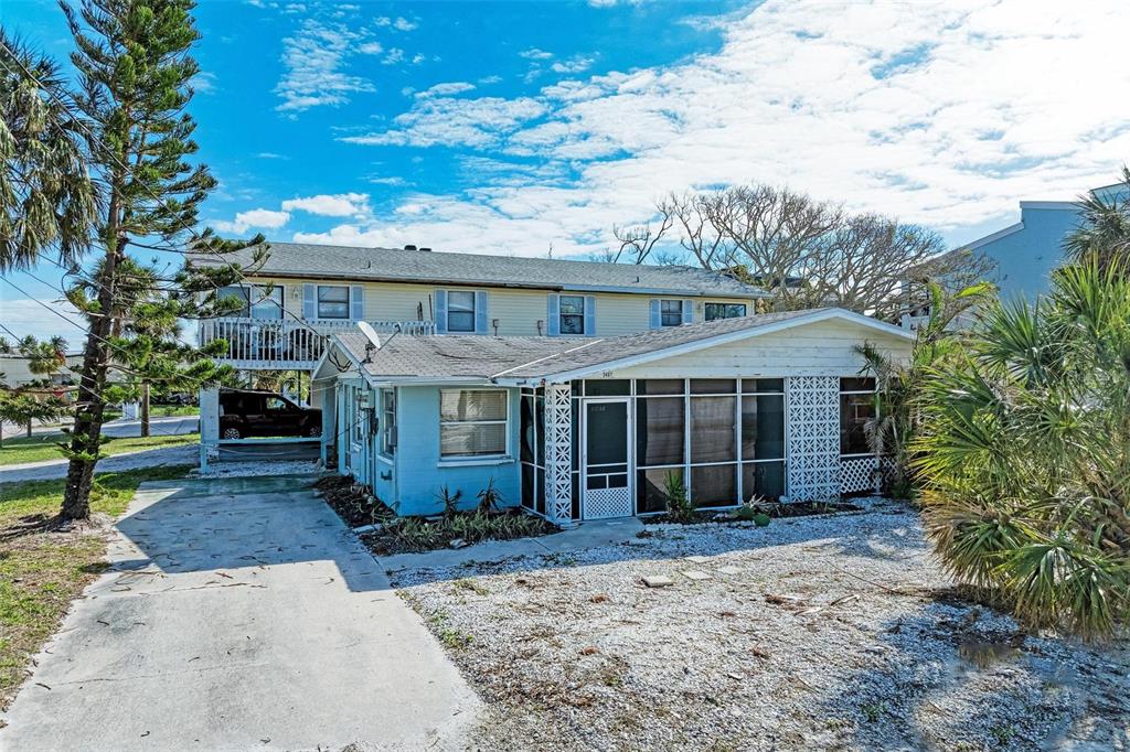 front view of a house with a garden