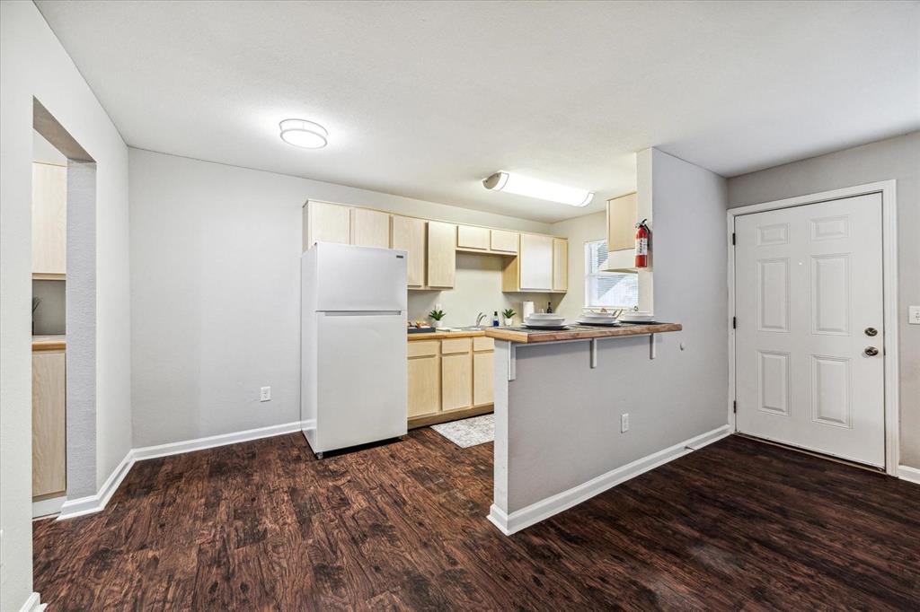 a view of kitchen with wooden floor