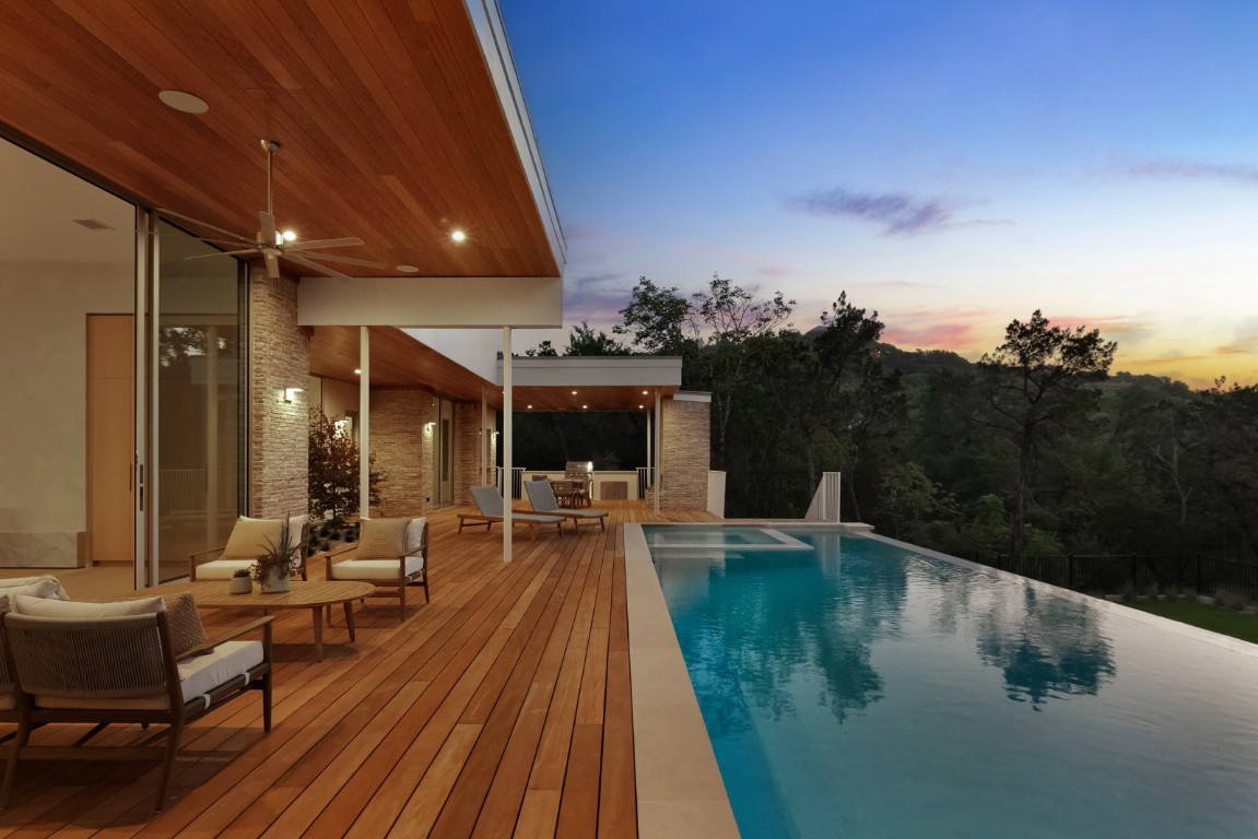 a view of a swimming pool with seating area