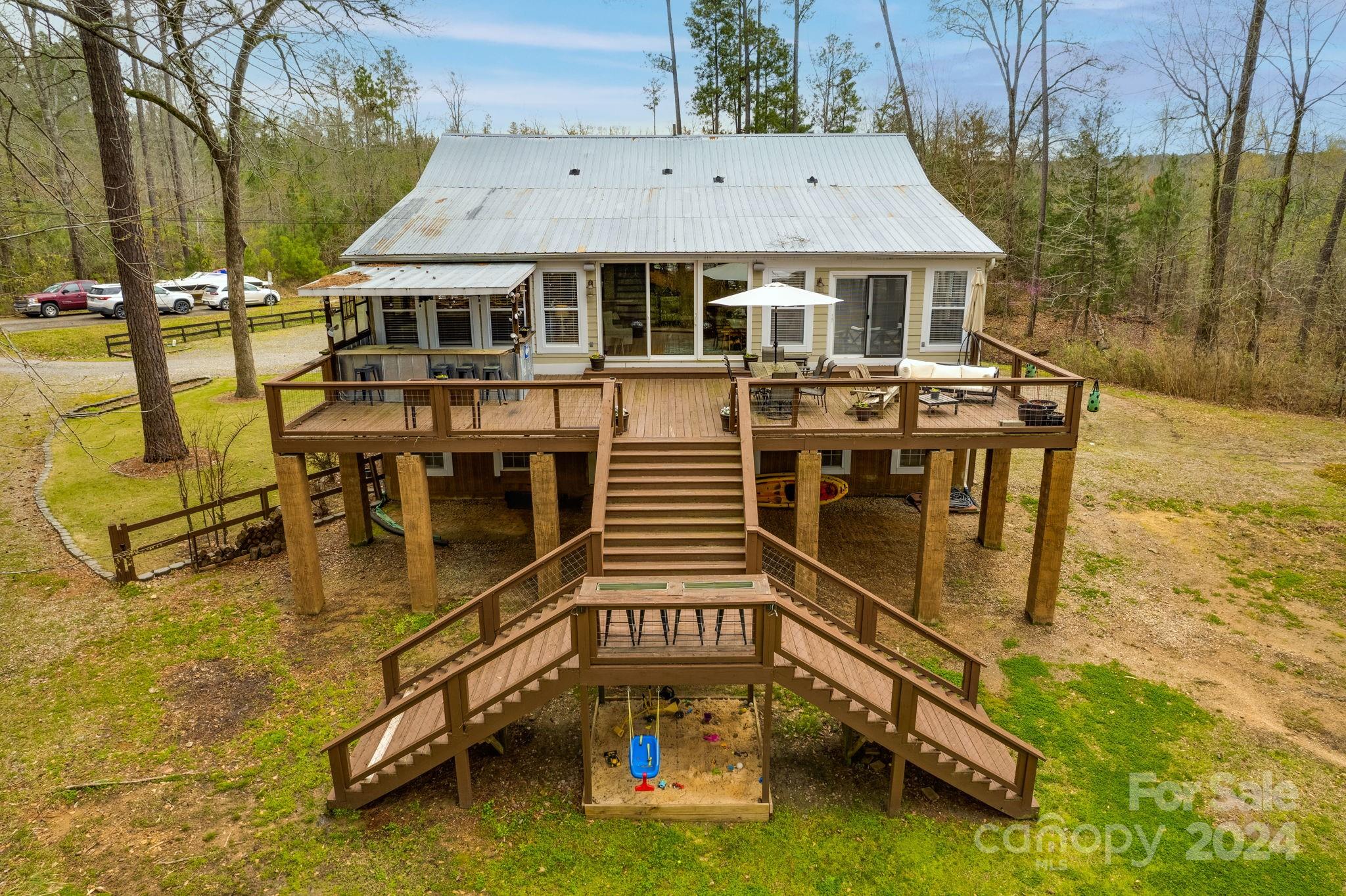 an aerial view of a house with swimming pool