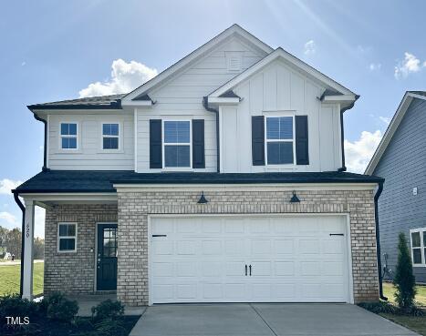 a front view of a house with garage