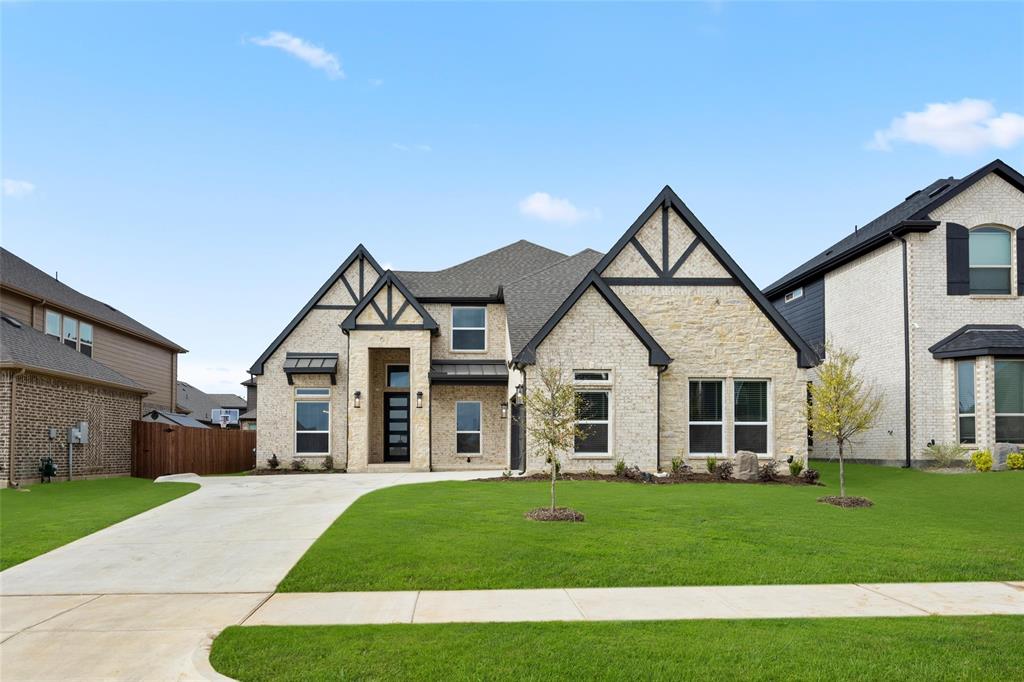 front view of a house with a yard