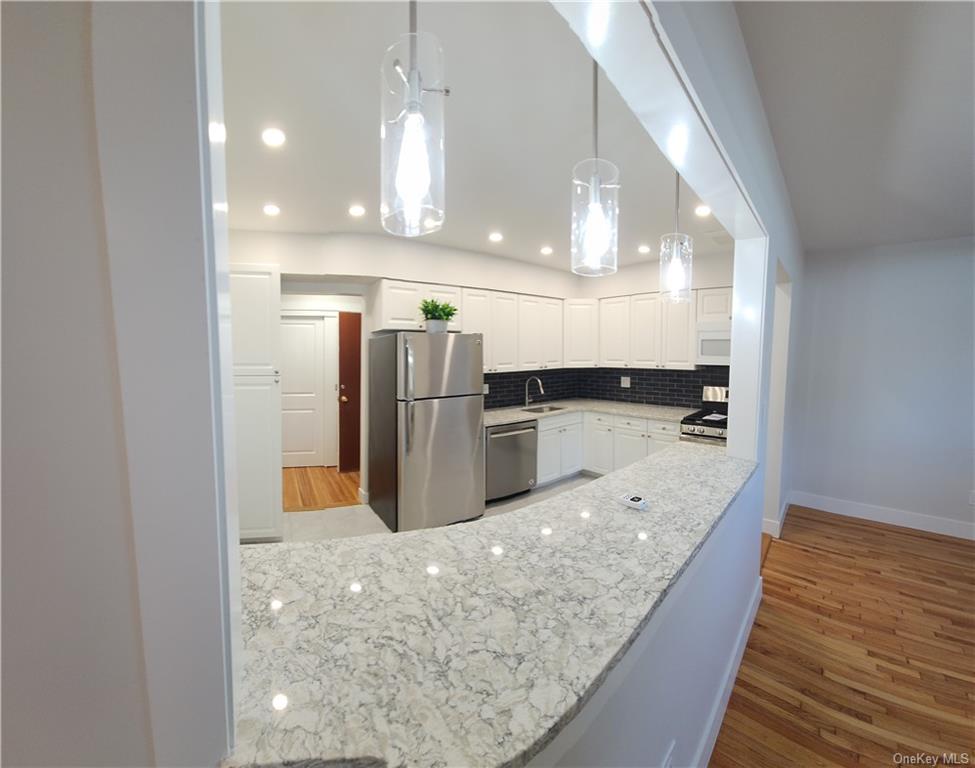 a view of kitchen with wooden floor