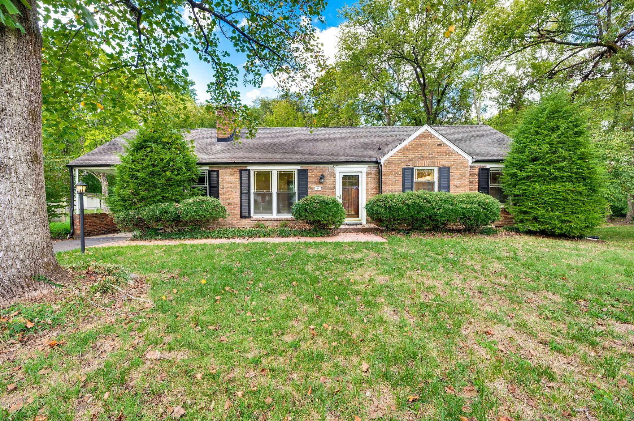 front view of a house with a yard