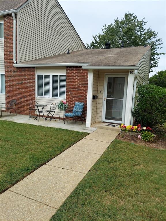 a house view with a garden space