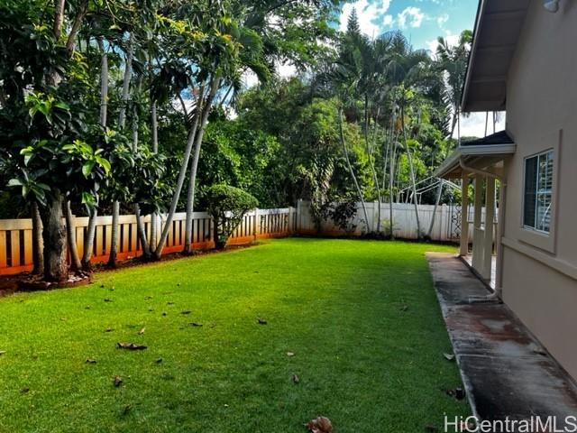 a view of yard with grass and a small yard