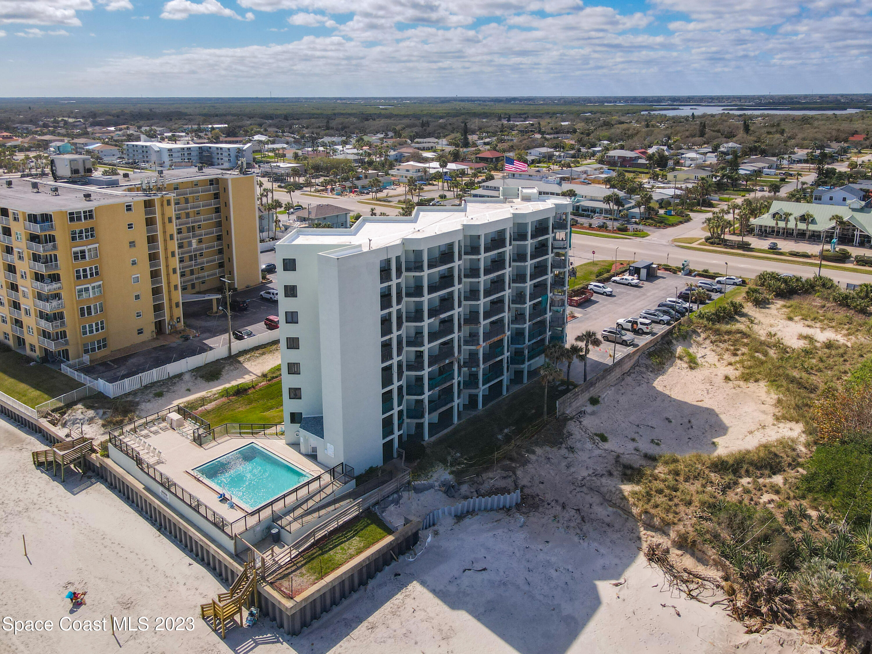 an aerial view of residential houses with outdoor space