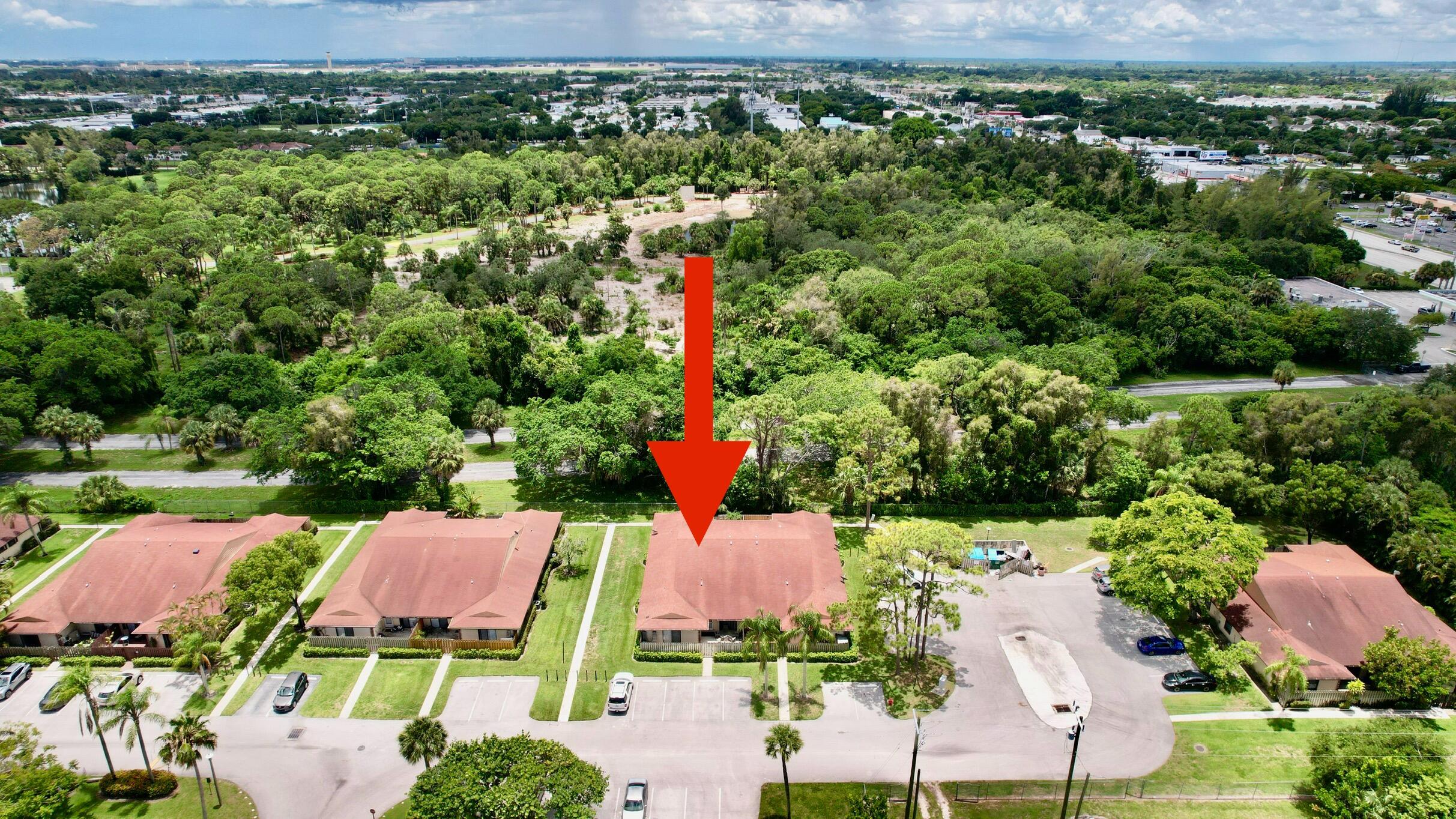 an aerial view of a houses with a yard