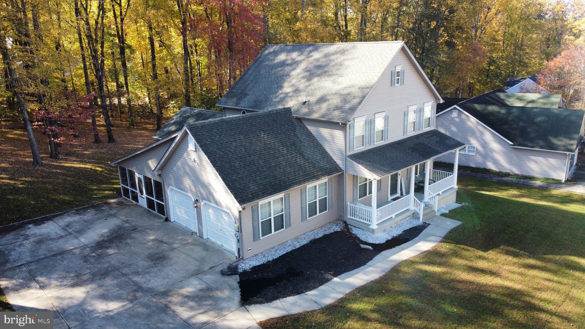 a aerial view of a house with a yard