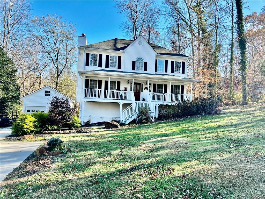 a view of a house with a yard and plants