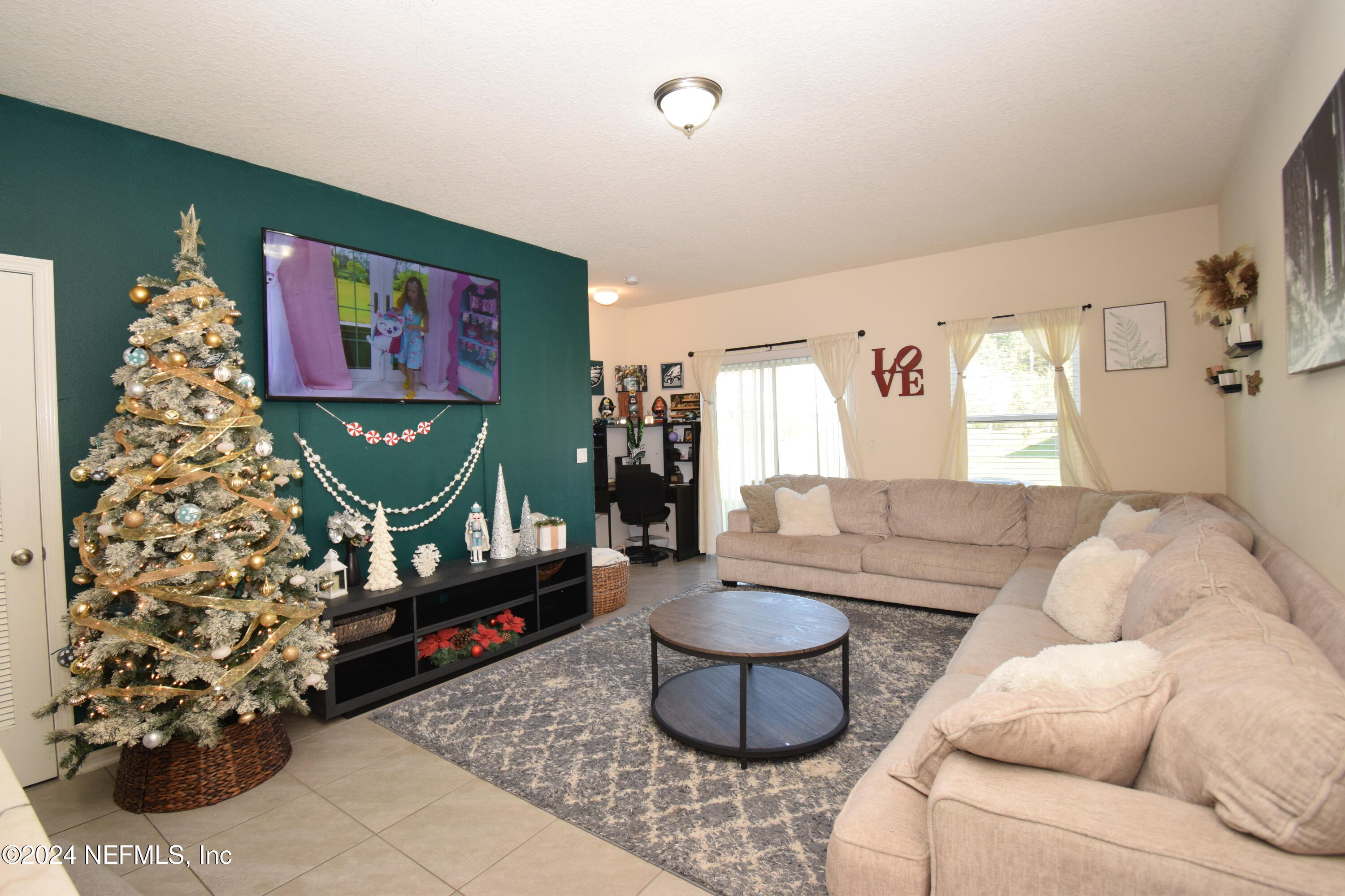 a living room with furniture and a rug