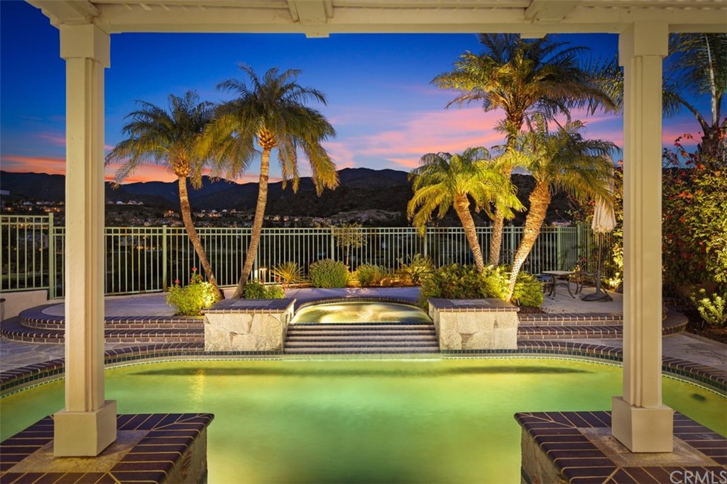 a view of a swimming pool with a lounge chairs