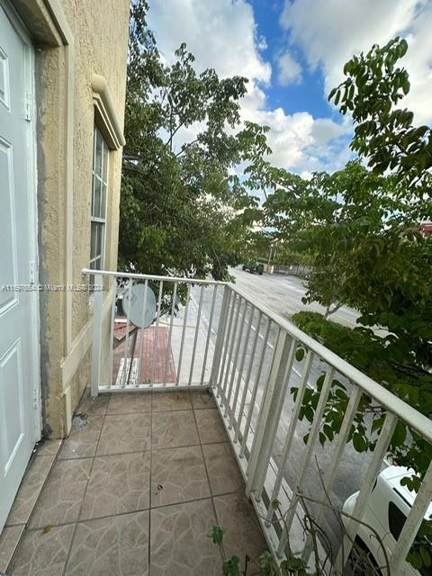 a balcony with wooden floor