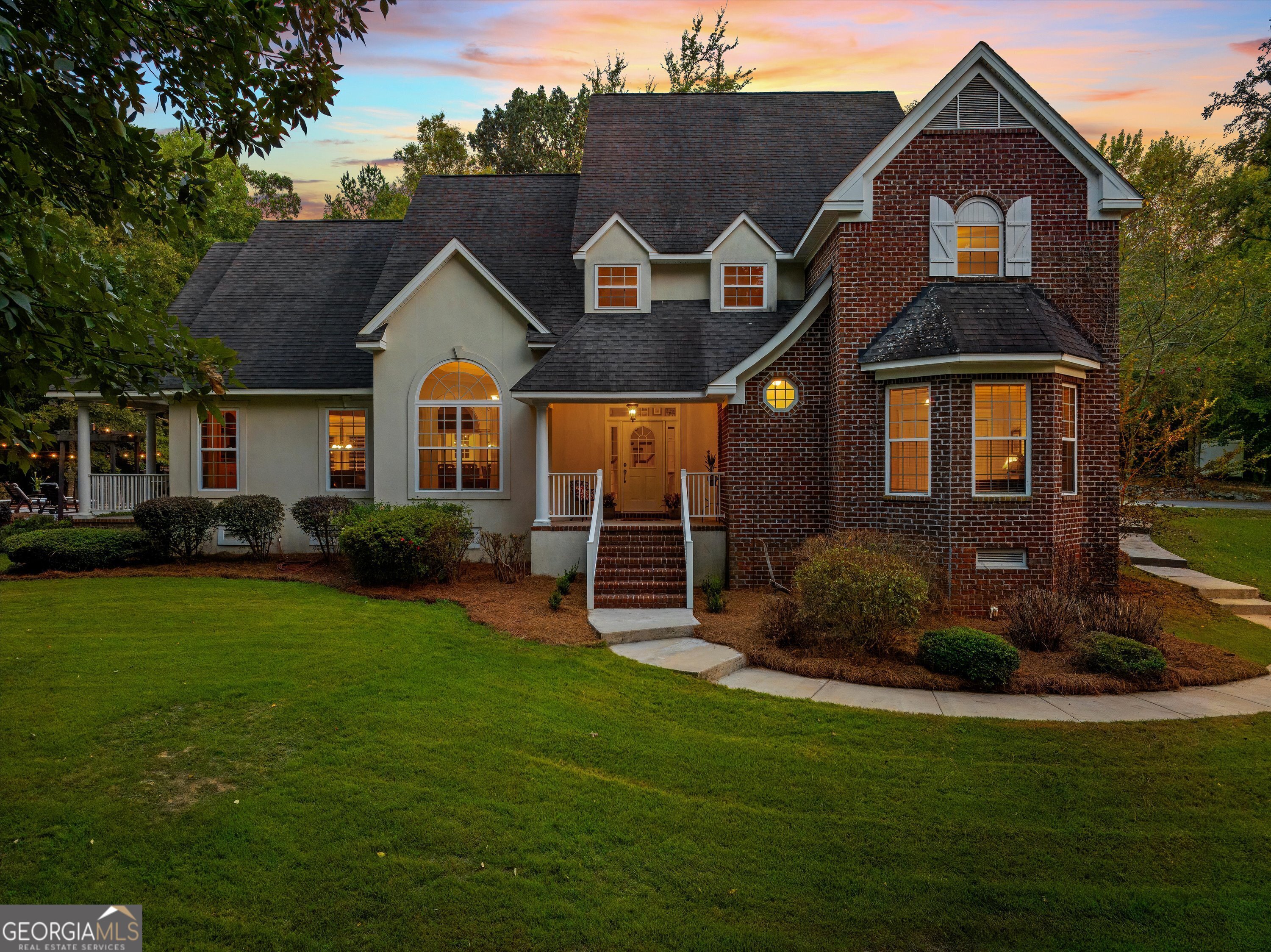 a front view of a house with a yard