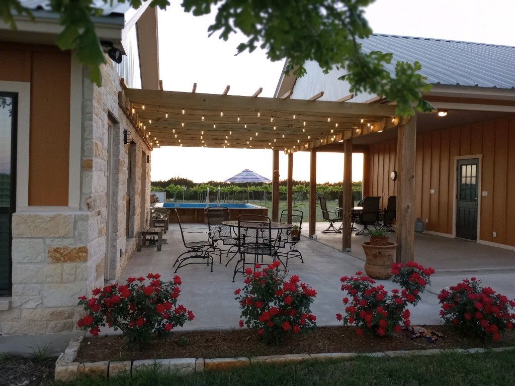 a view of a patio and garden