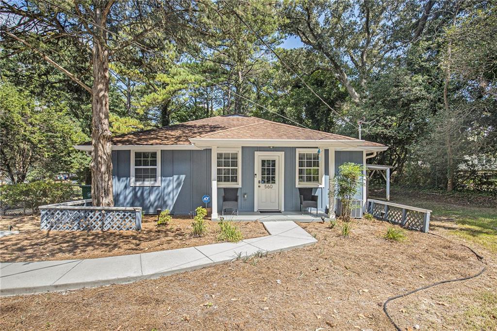 front view of a house with a yard