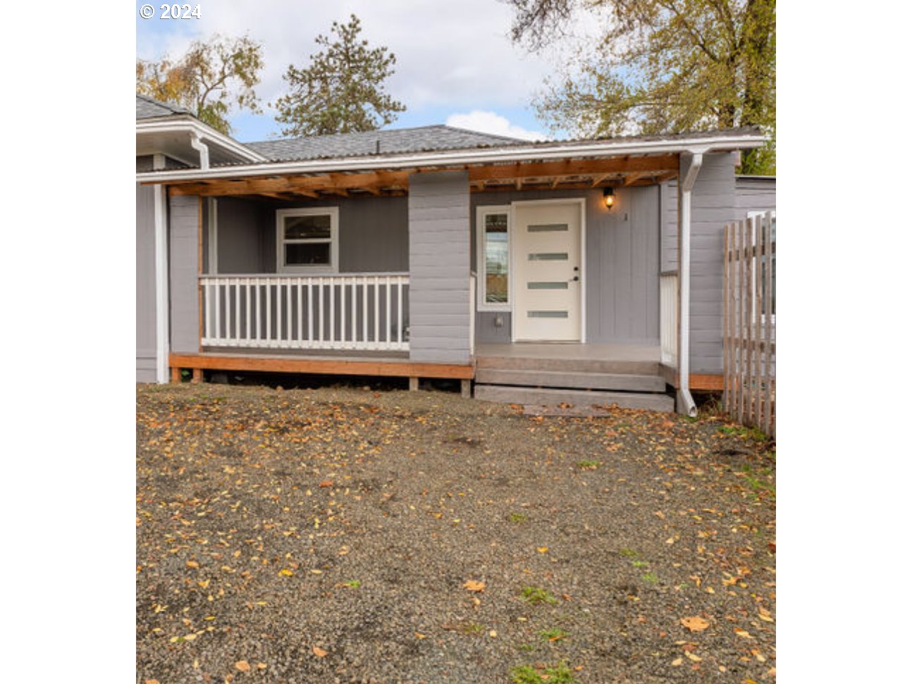 a porch with a sink and yard