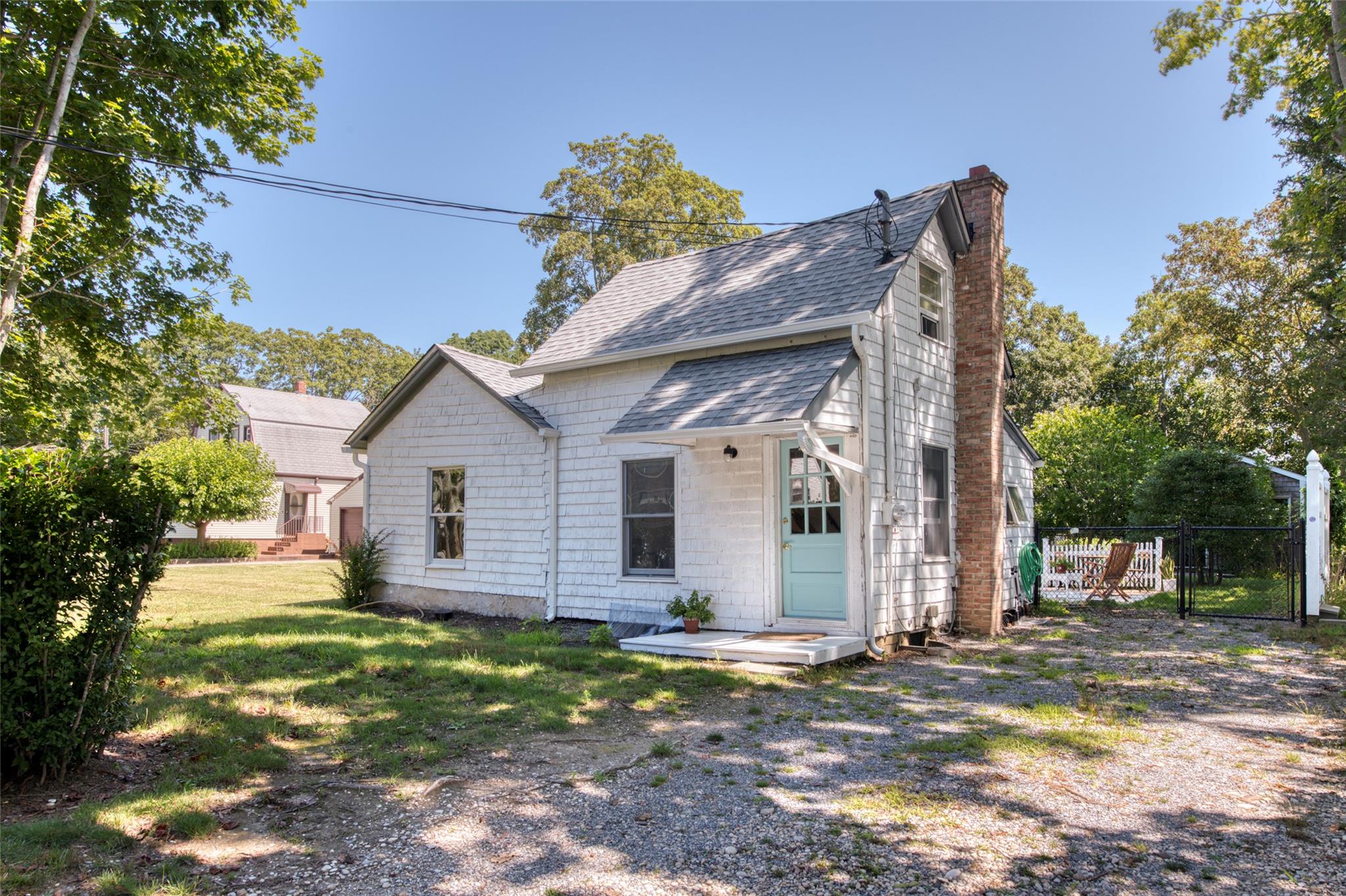 Back of house featuring a yard