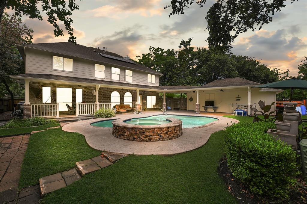 a front view of a house with a yard table and seating