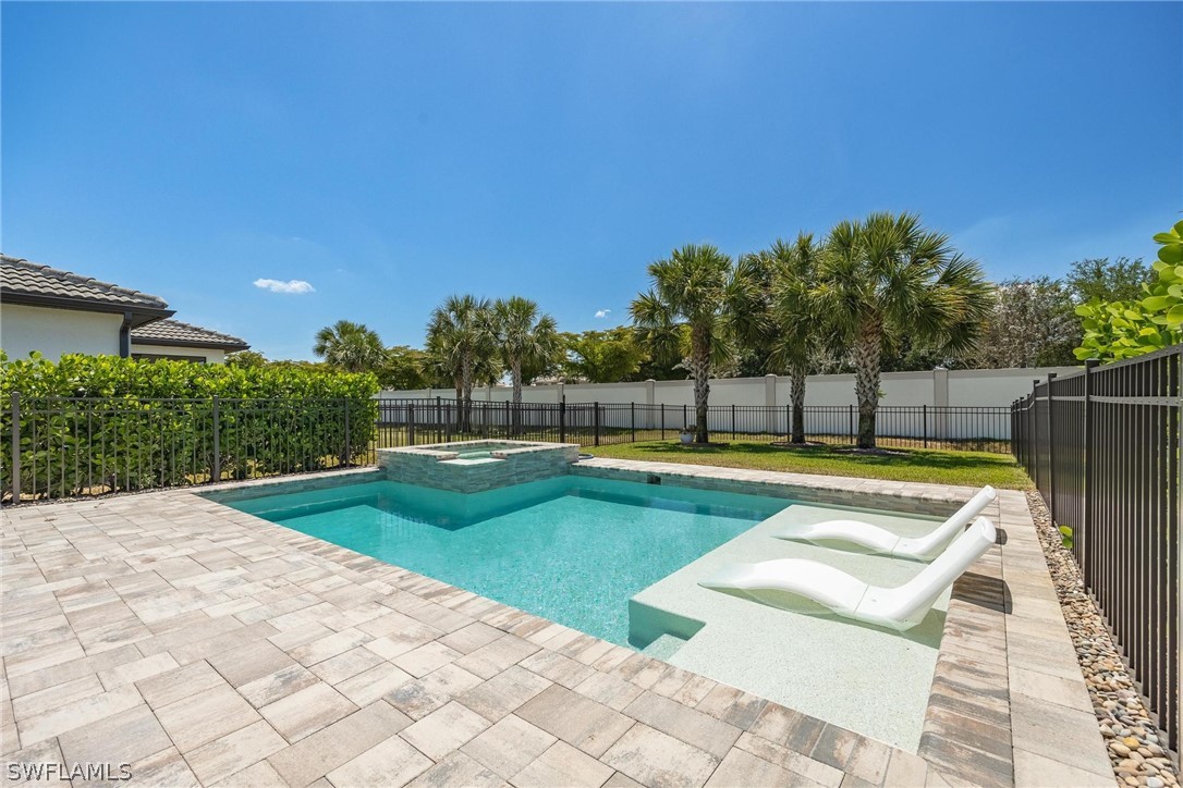 a view of a swimming pool with a yard