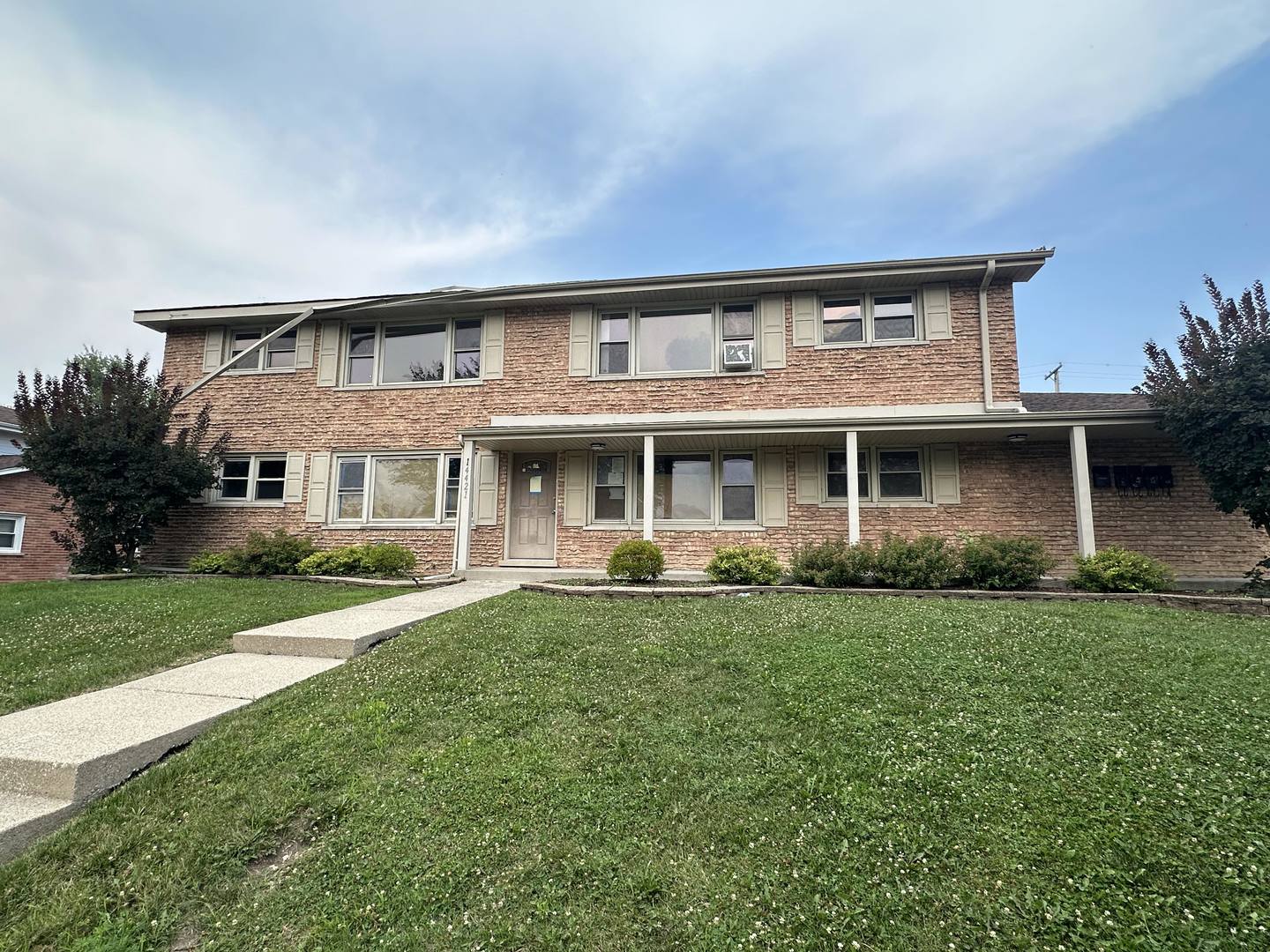 front view of a house with a yard