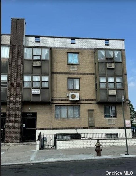 a front view of a house with glass windows