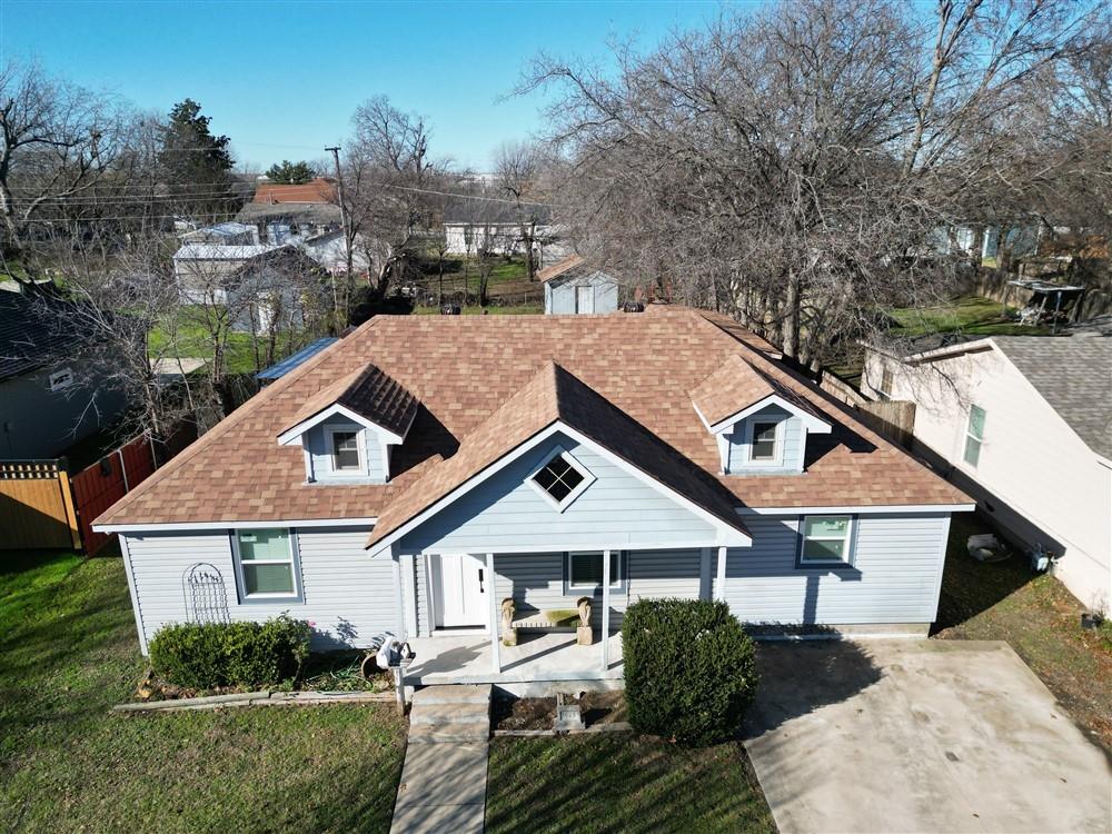 a house with trees in the background