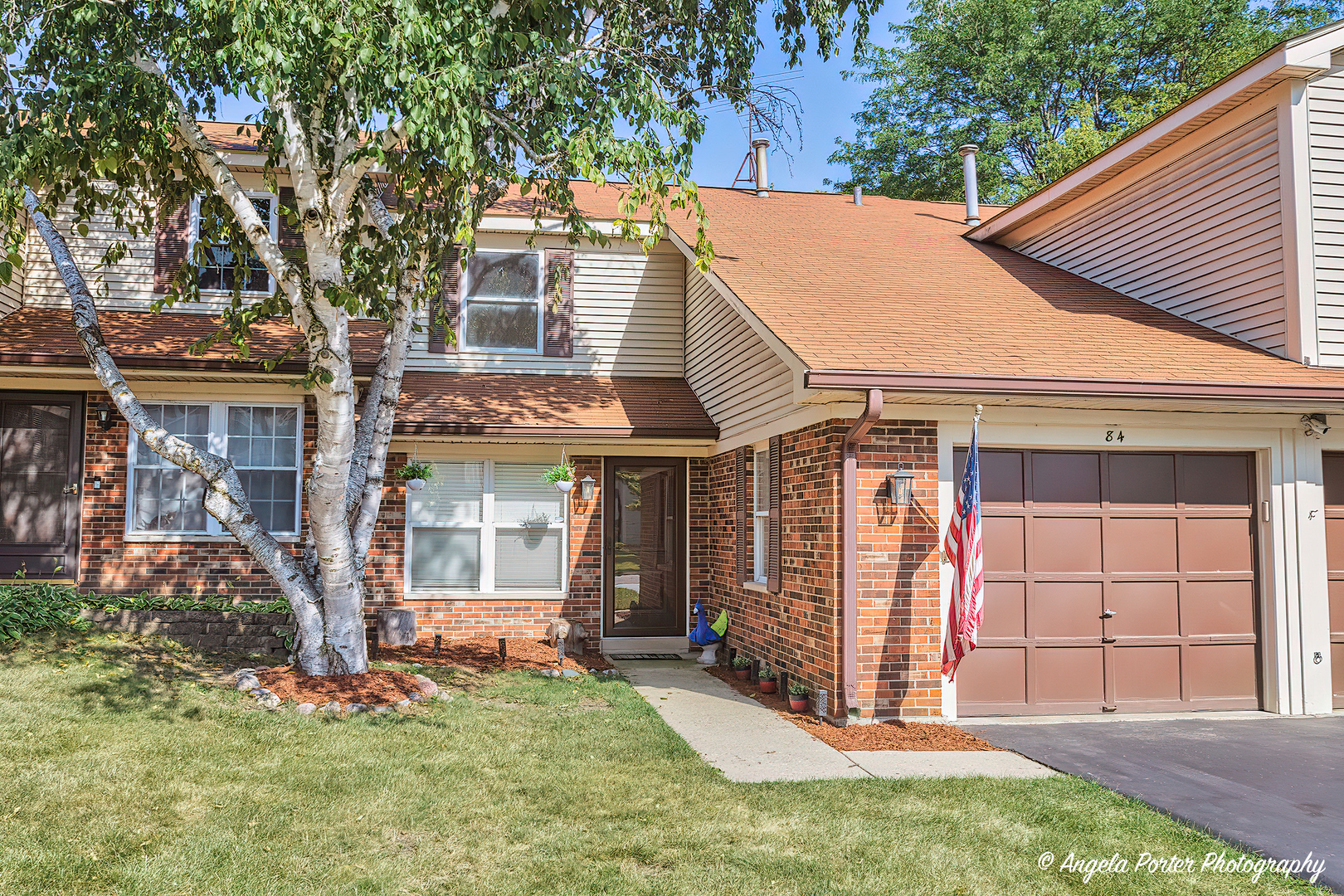 front view of a house with a yard