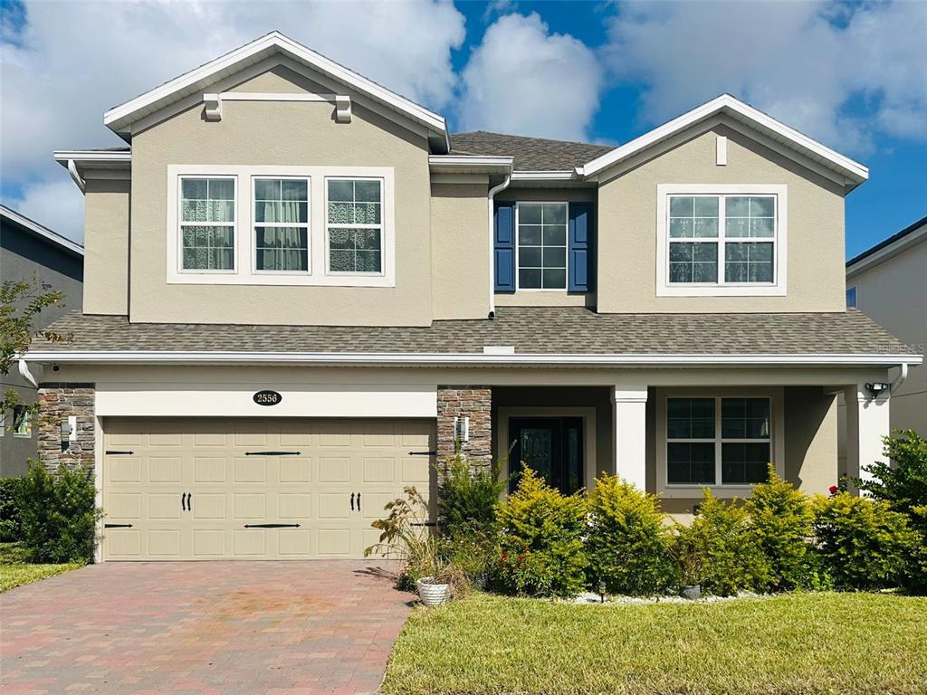 front view of a house with a yard