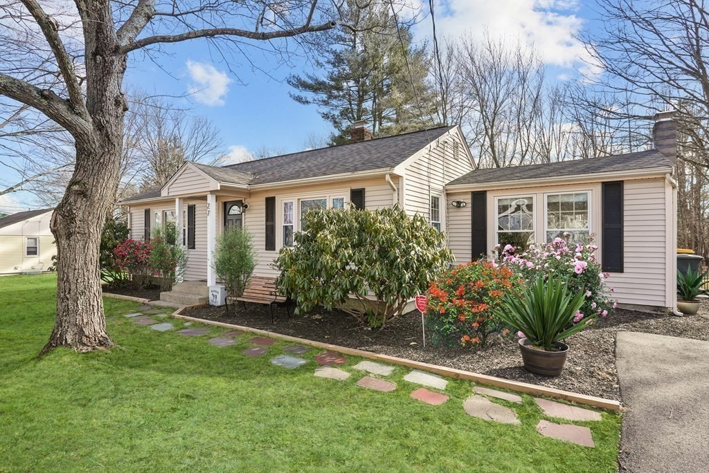 front view of a house with a yard