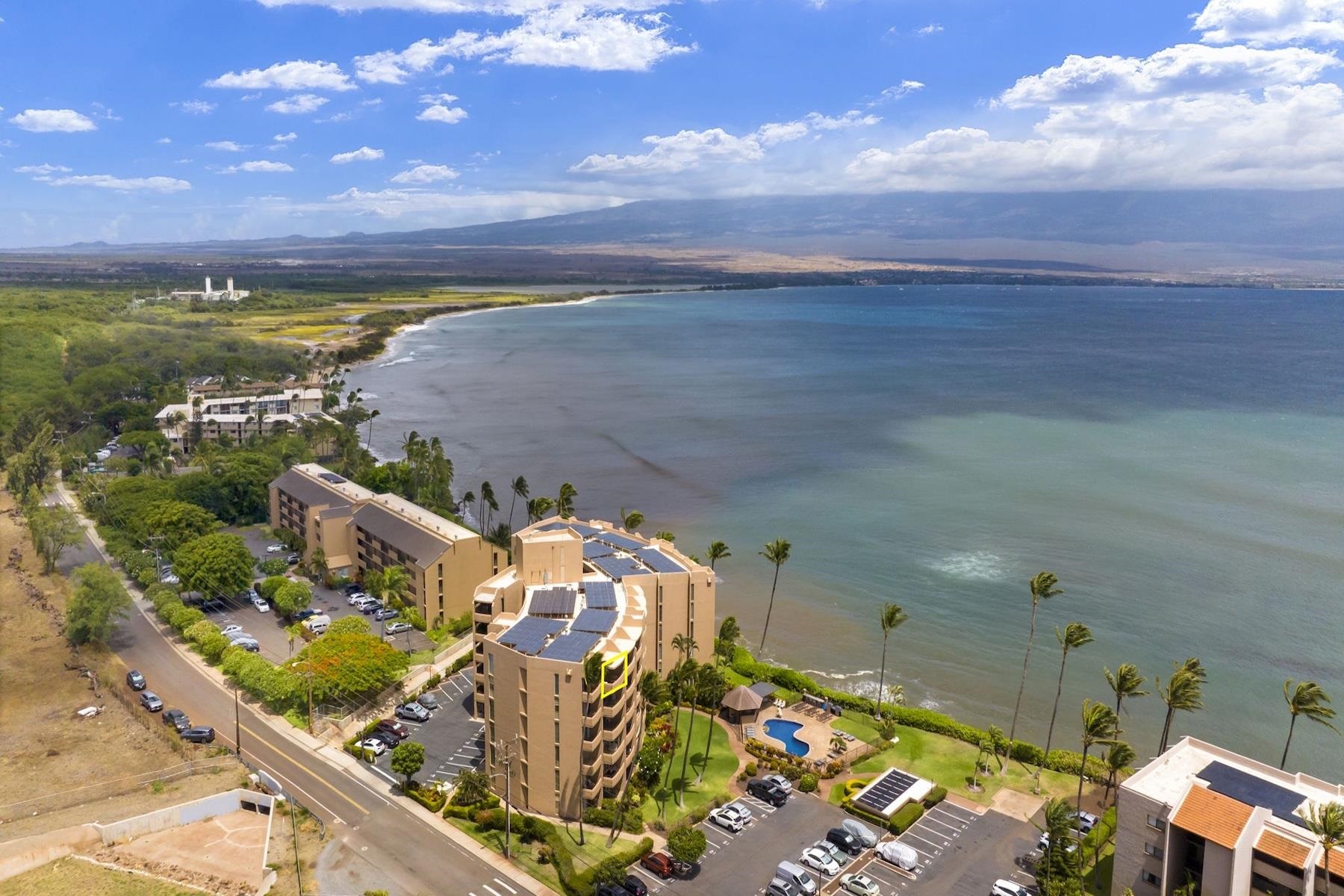 an aerial view of a house with a ocean view