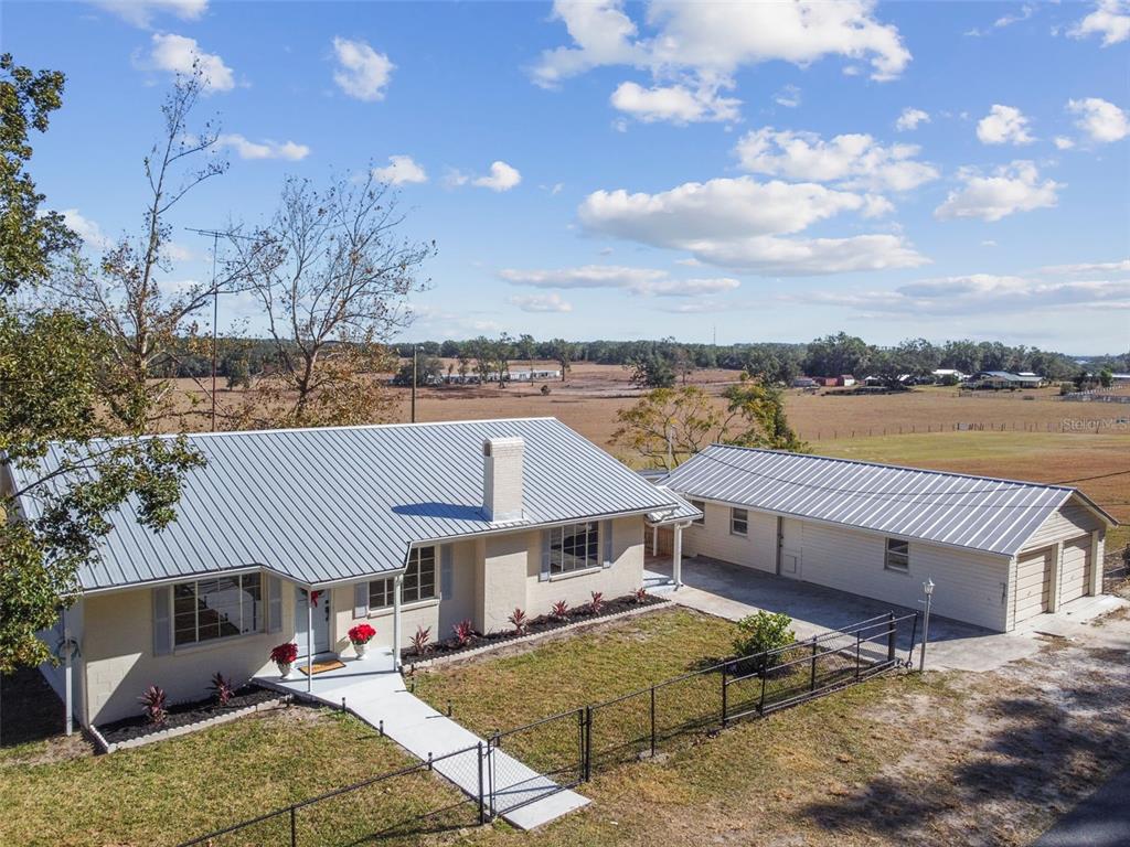 a aerial view of a house with a terrace