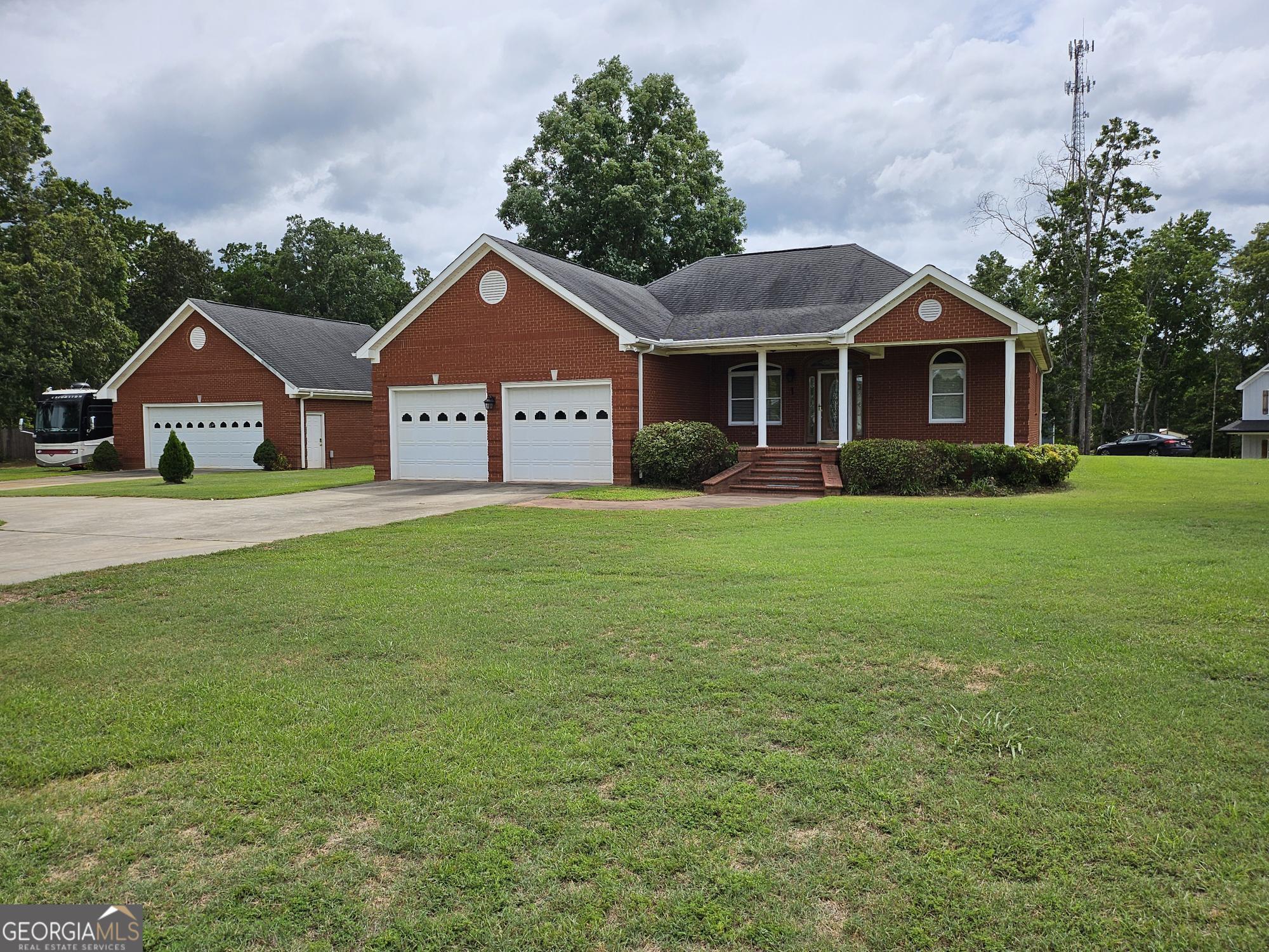 a front view of a house with a yard