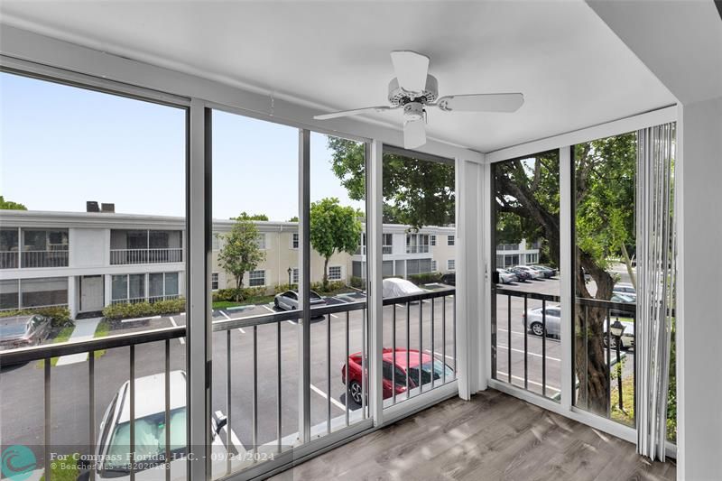 a view of a porch with wooden floor and outdoor space