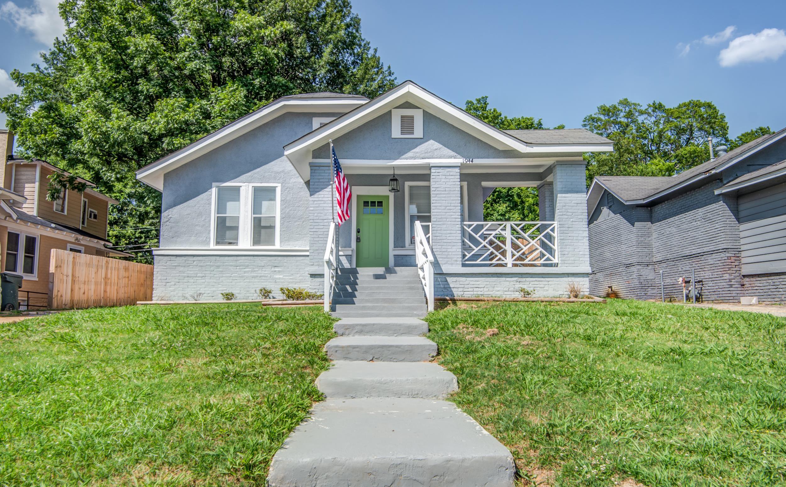 Bungalow-style house with covered porch and a front lawn