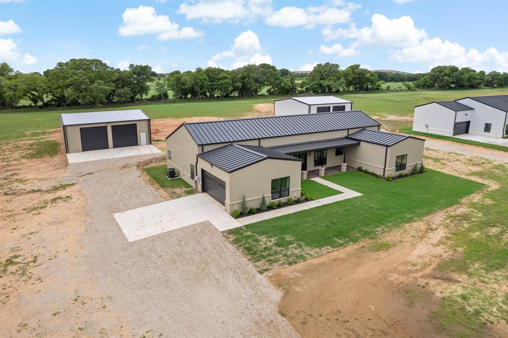 a aerial view of a house with pool